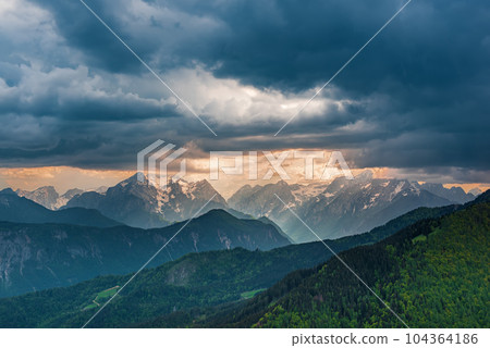 Dramatic sky mountains 104364186