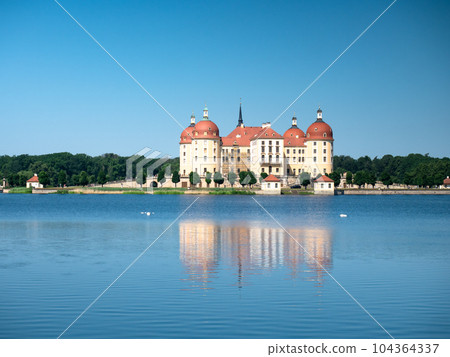 Panoramic view of the lake surrounding Moritzburg castle 104364337