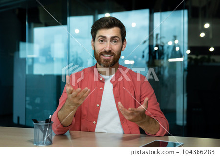 Mature man in shirt smiling and looking at camera, video call online meeting, webcam view, pov, worker at workplace inside office. Mature man in shirt smiling and looking at camera, video call online meeting, webcam view, pov, worker at workplace inside office. 104366283