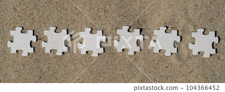 Six 6 wooden white puzzles copy space for your text on sandy beach. Summer vacation and holiday business travel concept. Jigsaw on the beach sand matching puzzle pieces together Template Mock up for Six 6 wooden white puzzles copy space for your text on sandy beach. Summer vacation and holiday business travel concept. Jigsaw on the beach sand matching puzzle pieces together Template Mock up for 104366452