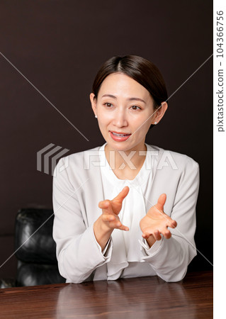 Woman having a conversation Interview 104366756