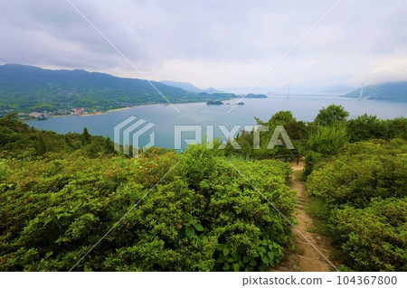 Think of the Shimanami Kaido and the Seto Inland Sea during the rainy season. The quiet Seto Inland Sea, the scenery of the islands connected by bridges, the sea sky, and early summer will soon come Think of the Shimanami Kaido and the Seto Inland Sea during the rainy season. The quiet Seto Inland Sea, the scenery of the islands connected by bridges, the sea sky, and early summer will soon come 104367800