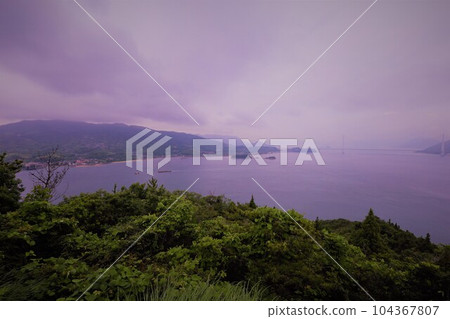 Think of the Shimanami Kaido and the Seto Inland Sea during the rainy season. The quiet Seto Inland Sea, the scenery of the islands connected by bridges, the sea sky, and early summer will soon come Think of the Shimanami Kaido and the Seto Inland Sea during the rainy season. The quiet Seto Inland Sea, the scenery of the islands connected by bridges, the sea sky, and early summer will soon come 104367807