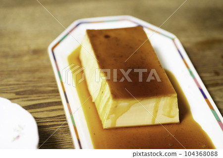 A large pudding on a plate 104368088