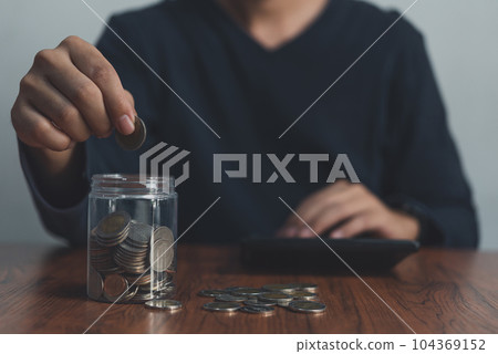 Man holding a coin jar.investment financial and banking, savings money, buying insurance, retirement money.business finance management concept. 104369152