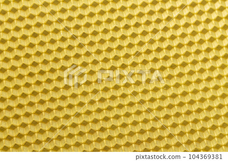 Texture and yellow wax bee hive honeycomb 104369381