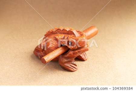 Wooden guiro frog percussion music or toy 104369384
