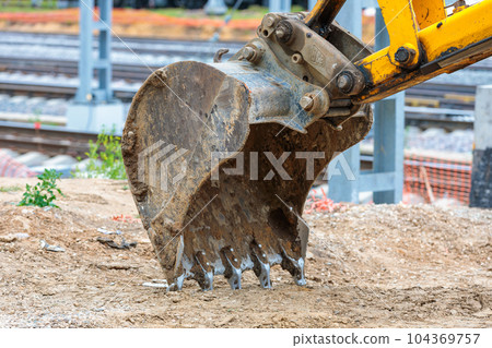 The powerful bucket of a construction excavator. 104369757