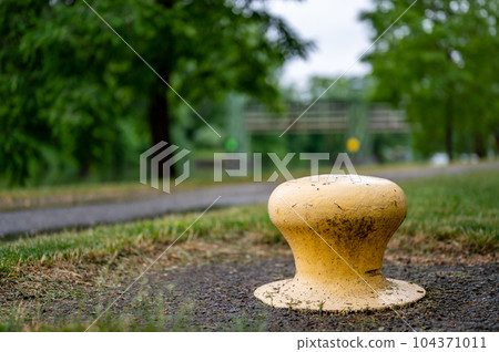 Bollard on the Erie Canalway Trail bike path in Rochester, New York 104371011