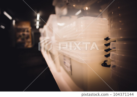Rows of stacked plastic containers for organization and storage. Rows of stacked plastic containers for organization and storage. 104371144