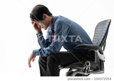 Depressed businessman light and dark 104372054