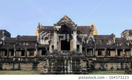 An abandoned medieval Khmer edifice in Angkor, Cambodia tells a tale of the city's rich yet lost grandeur. 104373223