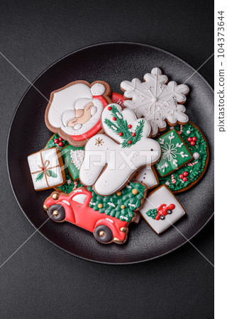 Beautiful Christmas or New Year colorful homemade gingerbread cookies Beautiful Christmas or New Year colorful homemade gingerbread cookies 104373644