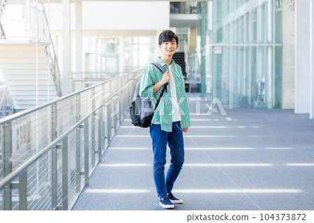College students walking in the school hallway College students walking in the school hallway 104373872