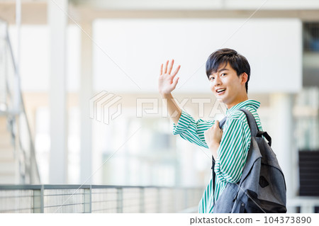 College students walking in the school hallway 104373890