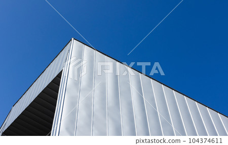 Abstract architecture background with a corner of metal walls 104374611