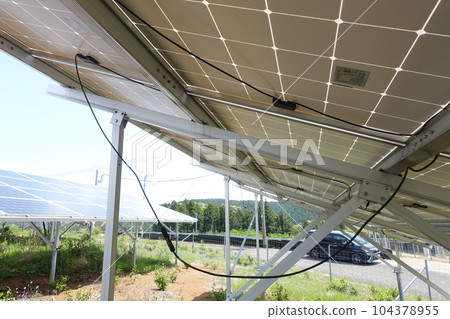 Power plant with hanging solar panel cables 104378955
