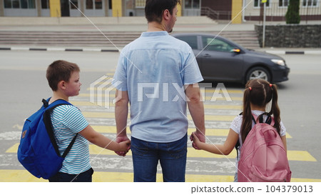 asphalt zebra crossing, school road, student happy family road, green light, father hand girl boy, child with school backpack, child pupils cross road zebra, boy, friends classmates pass car 104379013
