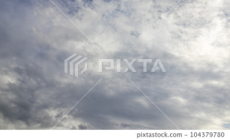 White clouds flowing in the blue sky at noon 104379780
