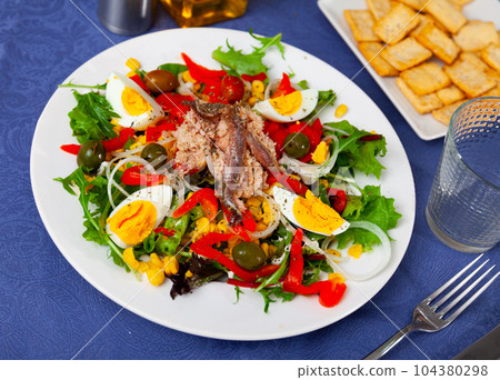 Xato salad with cod, chopped eggs and corn 104380298