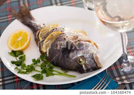 Baked in oven dorado fish Baked in oven dorado fish 104380474