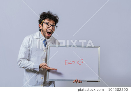 Physics professor holding whiteboard with a mathematical formula. Scientist holds and points to a whiteboard with a mathematical formula. Scientist showing blackboard with mathematical equation 104382290