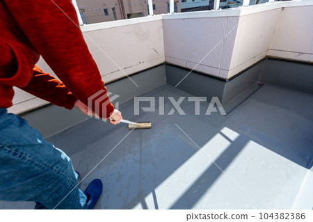 A man cleaning the balcony Balcony A man cleaning the balcony Balcony 104382386