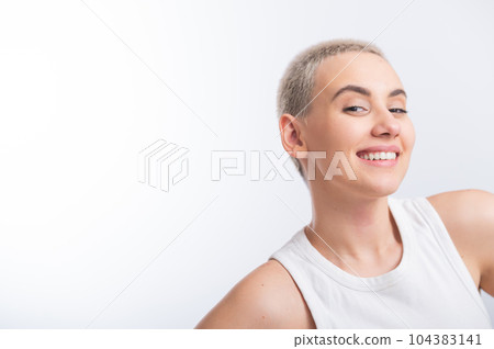 Beautiful young caucasian woman with a short haircut on a white background. Beautiful young caucasian woman with a short haircut on a white background. 104383141