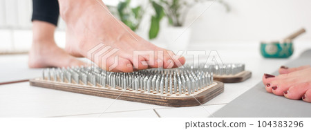 Caucasian and Asian women stand up sadhu boards together. Caucasian and Asian women stand up sadhu boards together. 104383296