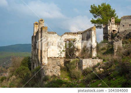 Abandoned Greek village in Turkey. Stone houses and ruins of Fethiye Kayakoy. 104384000