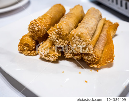 deep fried spring roll with Taro paste in plate 104384409