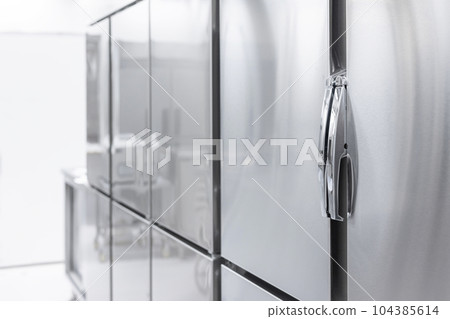 Closed large commercial refrigerator in the kitchen 104385614