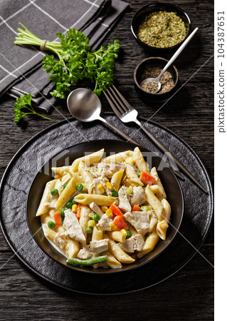 Creamy Chicken and Penne Pasta Casserole in bowl Creamy Chicken and Penne Pasta Casserole in bowl 104387651