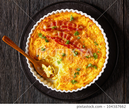 Cheddar Cheese Grits Casserole with bacon slices Cheddar Cheese Grits Casserole with bacon slices 104387662