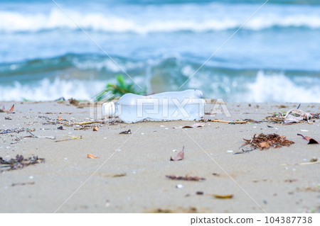 Plastic bottles washed up on the beach | Marine garbage image | Coastal cleaning image Plastic bottles washed up on the beach | Marine garbage image | Coastal cleaning image 104387738