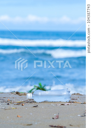 Plastic bottles washed up on the beach | Marine garbage image | Coastal cleaning image 104387743