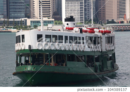 Star ferry sailing through Victoria Bay in Hong Kong Star ferry sailing through Victoria Bay in Hong Kong 104389137