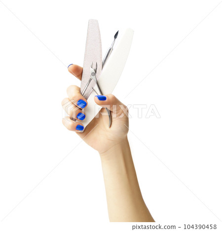 female hand with manicure holding manicure tools isolated on white female hand with manicure holding manicure tools isolated on white 104390458
