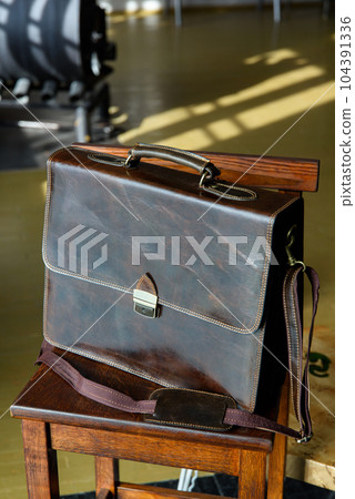 close-up photo of brown leather briefcase corporate. 104391336