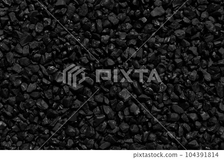 Natural fire ashes with dark grey black coals texture. It is a flammable black hard rock. Space for text. Natural fire ashes with dark grey black coals texture. It is a flammable black hard rock. Space for text. 104391814