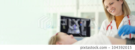 Doctor pediatrician conducting abdominal ultrasound examination of internal organs of child in clinic Doctor pediatrician conducting abdominal ultrasound examination of internal organs of child in clinic 104392015