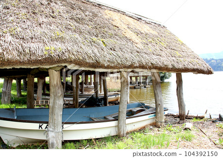 Thatched boat hut Lake Mikata Lakeside Mikata Five Lakes Funagoya thatched roof Wakasa Town Fukui Mikata Kaminaka District Sakura Spring scenery Thatched boat hut Lake Mikata Lakeside Mikata Five Lakes Funagoya thatched roof Wakasa Town Fukui Mikata Kaminaka District Sakura Spring scenery 104392150