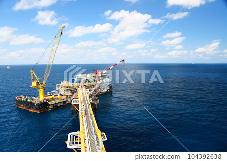 Offshore construction platform for production oil and gas. Oil and gas industry and hard work. Production platform and operation process by manual and auto function from control room. 104392638