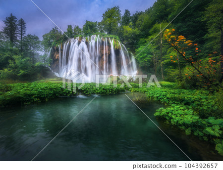 Waterfall in green forest in Plitvice Lakes, Croatia at sunset Waterfall in green forest in Plitvice Lakes, Croatia at sunset 104392657