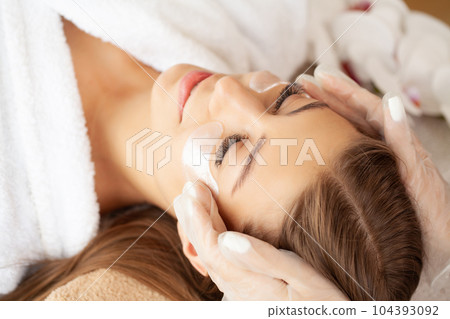 Woman getting spa massage treatment at beauty spa salon Woman getting spa massage treatment at beauty spa salon 104393092