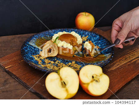 Apple tart with fresh apples on wooden table 104394117