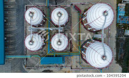Aerial top view LPG Liquefied Petroleum Gas storage tank, LPG gas storage tank and pipeline industrial plant, LPG distribution station facility and gas manufacturing industry. Aerial top view LPG Liquefied Petroleum Gas storage tank, LPG gas storage tank and pipeline industrial plant, LPG distribution station facility and gas manufacturing industry. 104395204