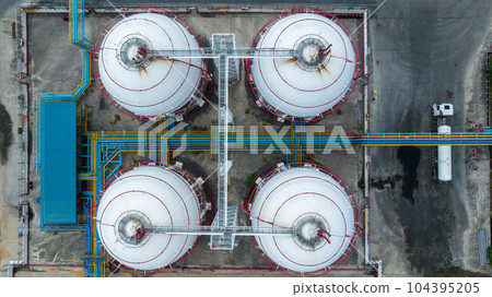 Aerial top view LPG Liquefied Petroleum Gas storage tank, LPG gas storage tank and pipeline industrial plant, LPG distribution station facility and gas manufacturing industry. Aerial top view LPG Liquefied Petroleum Gas storage tank, LPG gas storage tank and pipeline industrial plant, LPG distribution station facility and gas manufacturing industry. 104395205