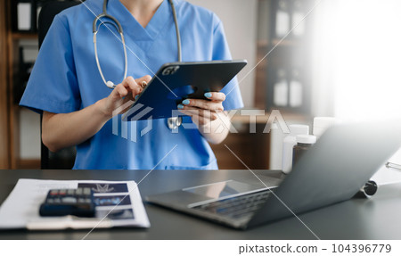 Medical technology concept. Doctor working with mobile phone and stethoscope in office. 104396779