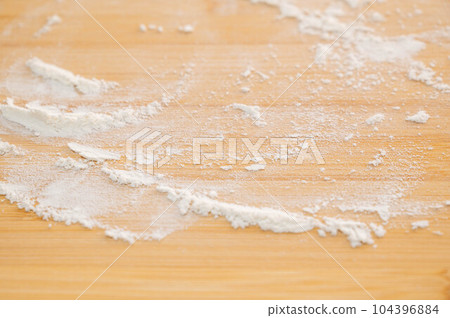 Flour sifted on a cutting board Flour sifted on a cutting board 104396884